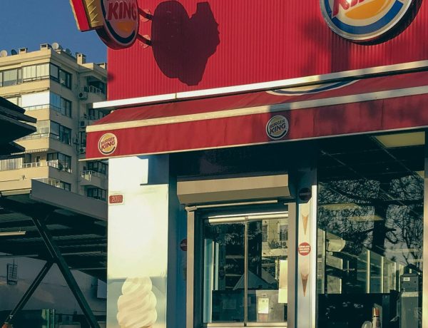 Burger King restaurant exterior with signage and sunny outdoor view.